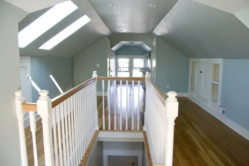 Attic room with wooden ceiling and furnishings