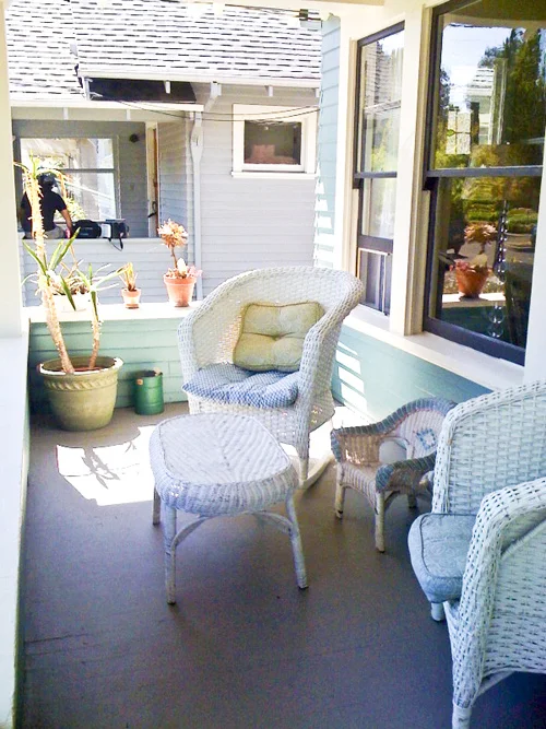 Child's wicker chair on a front porch